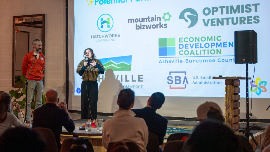 atchThis 225 participants on stage with local business orgs displayed on the screen behind them.