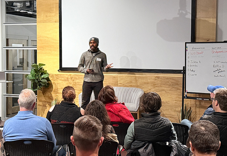 Rocky Sridhar on stage at Pitchgiving 2025 pitching Approachable Adventures