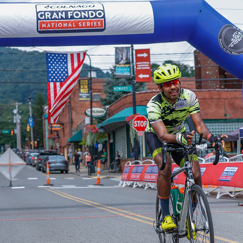 Rocky Sridhar on a bke at Gran Fondo enjoying outdoor activities.